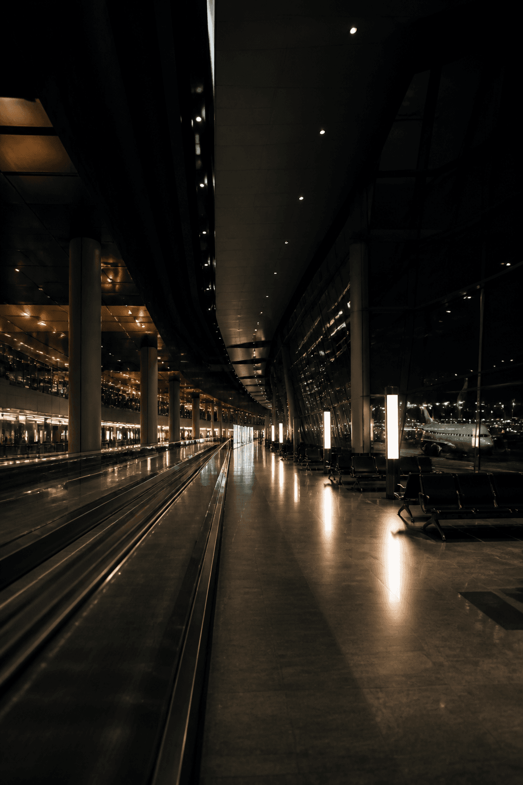 A long airport terminal hall at night